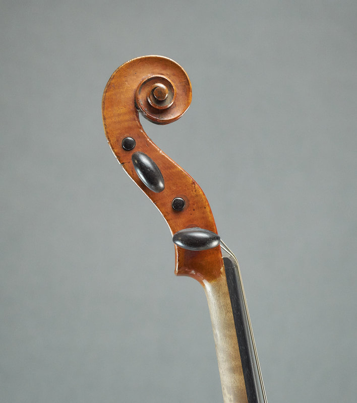 Scroll of Chappuy Violin, a class French antique instrument (side view)