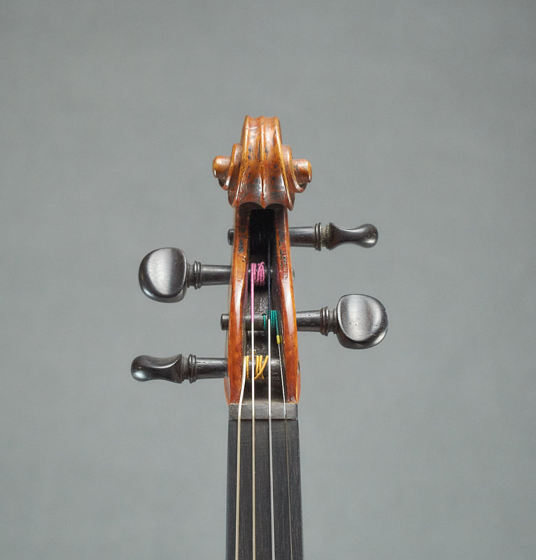 Scroll of Chappuy Violin, a class French antique instrument (front view)
