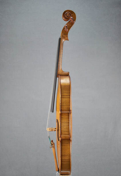 An antique, handmade Mirecourt Violin (1890) with stunning flamed maple and a beautiful sound.