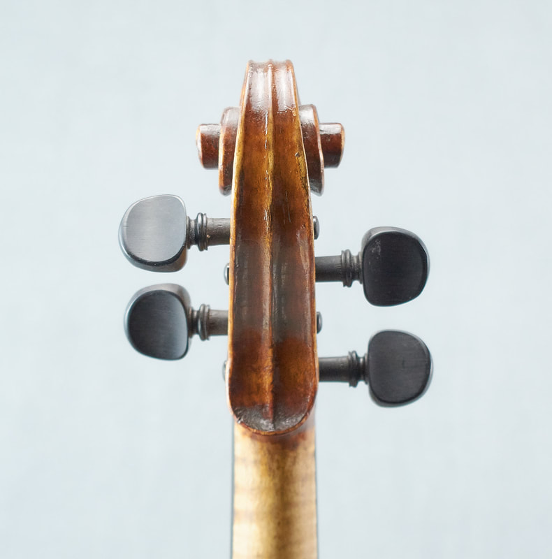 The scroll of a beautiful Fabienne Arimont handmade Violin (back view).