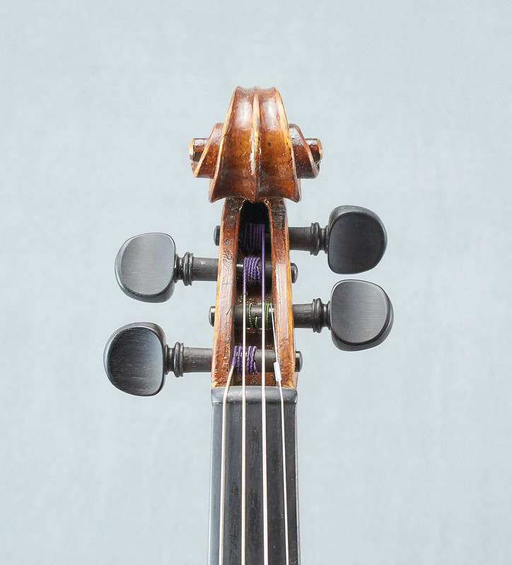 The scroll of a beautiful Fabienne Arimont handmade Violin (front view).