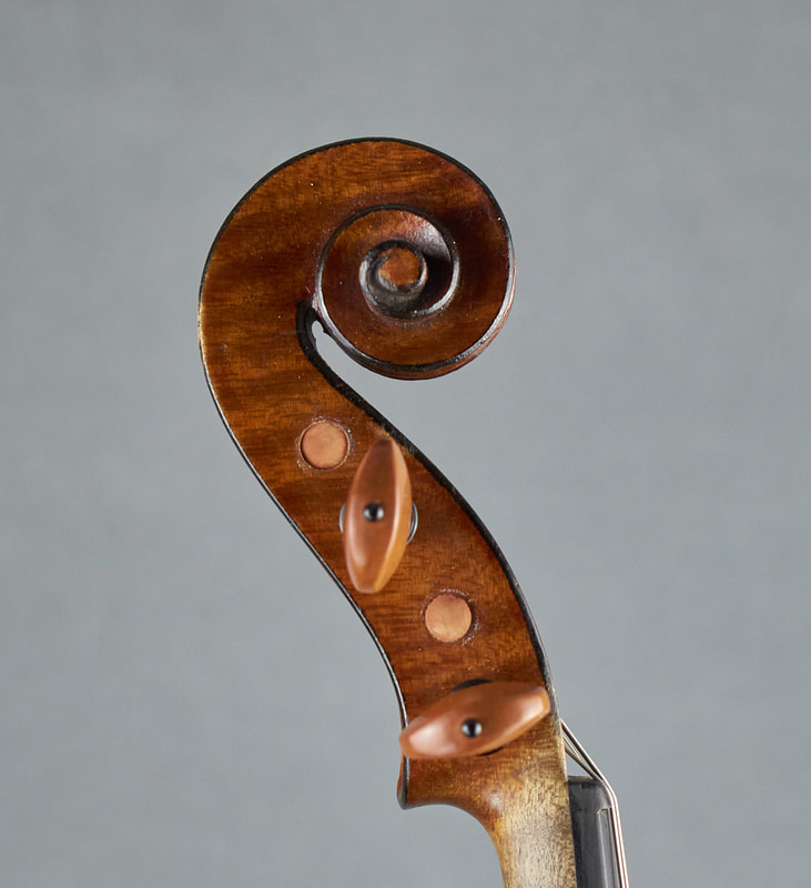 The scroll of a Mirecourt Violin with exceptional sound and playability (side view).