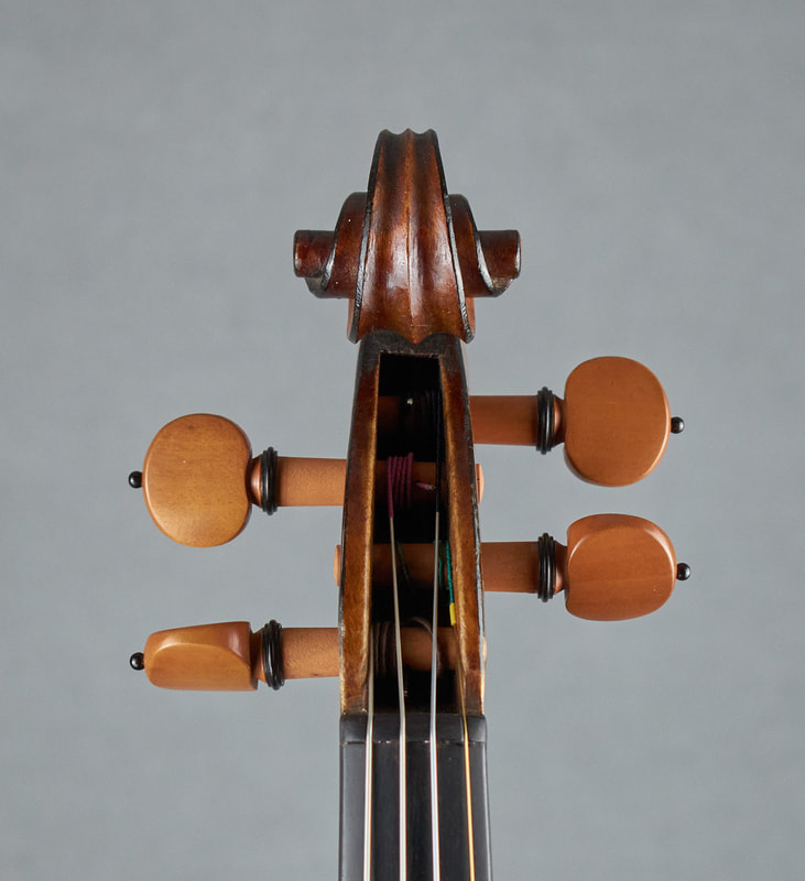The scroll of a Mirecourt Violin with exceptional sound and playability (front view).