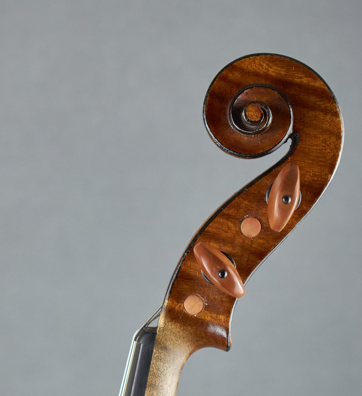 The scroll of a Mirecourt Violin with exceptional sound and playability (side view).
