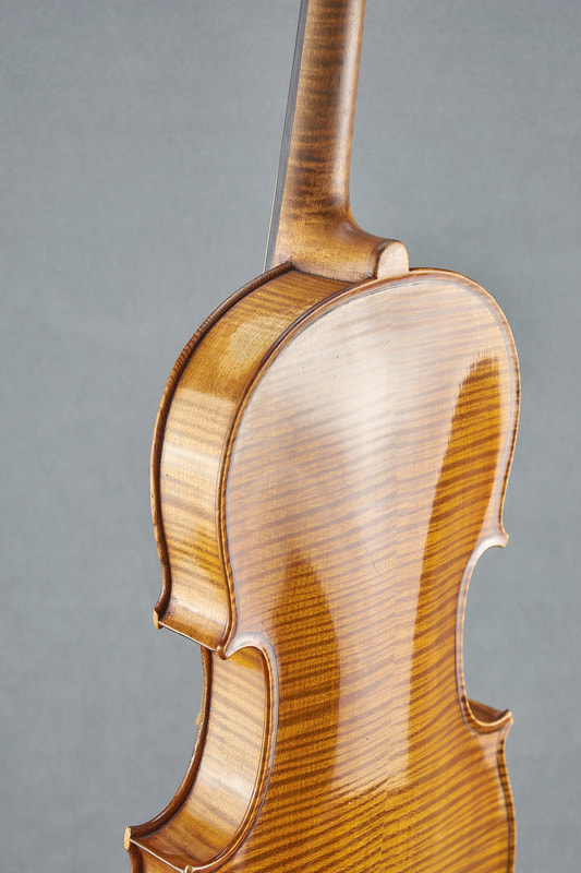 An antique handmade Mirecourt Violin (1890) with stunning flamed maple.